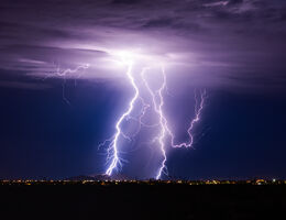 Lightning striking at night.